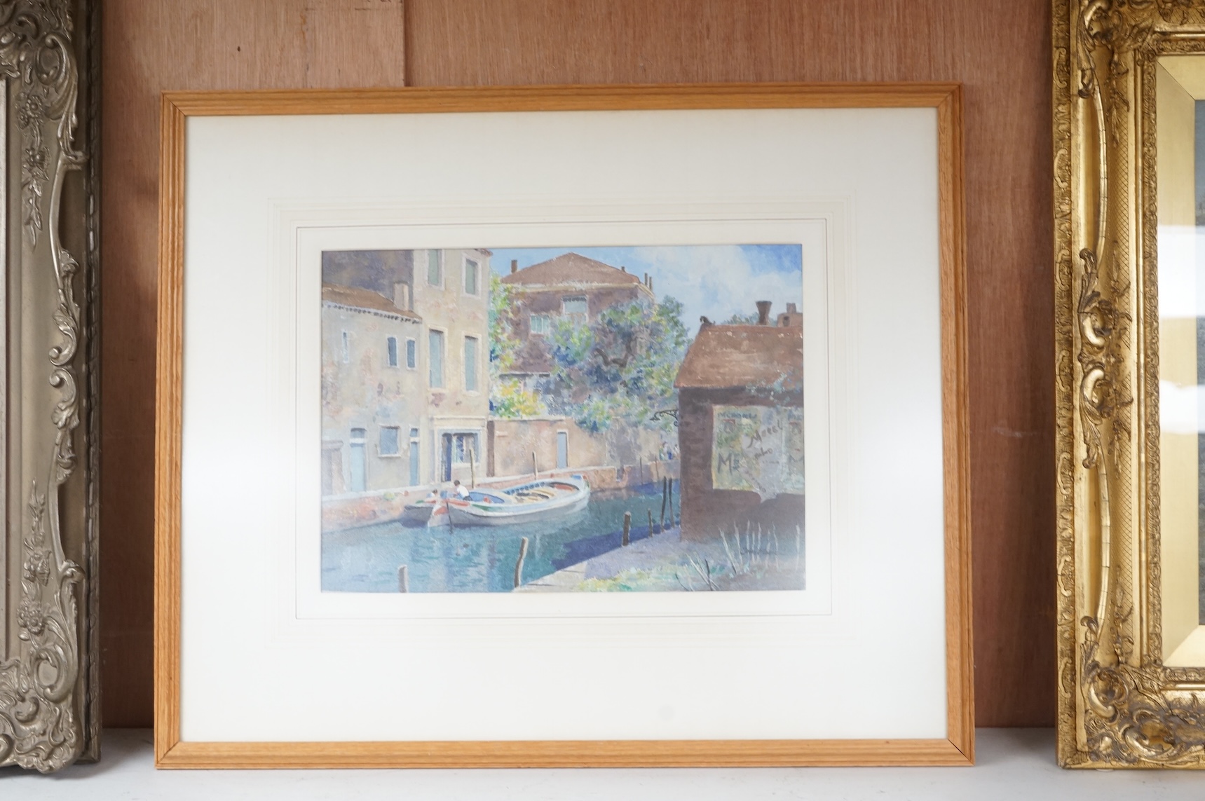 Rear Admiral Humfrey John Bradley Moore RI (1898-1985), watercolour, Venice, Barge in a side canal, signed, Royal Institute gallery's label verso, 27 x 37cm